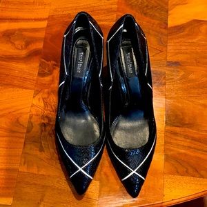 black with white detail snake pointed toe pumps.
